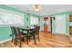 Inviting dining area with hardwood floors, large windows, and classic ceiling fan at 2601 Marldale St, Gastonia, NC 28052