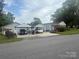 Well maintained single Gathering home featuring two carports and mature landscaping at 2601 Marldale St, Gastonia, NC 28052