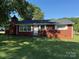Traditional brick home with a lush green lawn, showcasing its classic design and inviting exterior at 2601 Marldale St, Gastonia, NC 28052