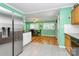 Open kitchen flowing into the dining area with modern appliances and ample counter space at 2601 Marldale St, Gastonia, NC 28052