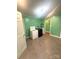 Well-lit laundry room featuring washer, dryer, and tile flooring at 2601 Marldale St, Gastonia, NC 28052
