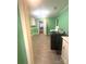 Laundry room complete with appliances, tile flooring, cabinets, and neutral paint at 2601 Marldale St, Gastonia, NC 28052