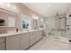 Elegant bathroom with double vanities, tile shower, and soaking tub at 2829 Holt St, Charlotte, NC 28205