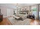 Charming bedroom with ample natural light, ensuite bath, and hardwood floors at 2829 Holt St, Charlotte, NC 28205