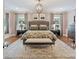 Spacious bedroom with beautiful hardwood floors, decorative rug, and neutral tones at 2829 Holt St, Charlotte, NC 28205