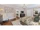 Airy bedroom featuring hardwood floors, ensuite bath, walk-in closet, and stylish decor at 2829 Holt St, Charlotte, NC 28205