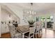 Bright dining area with hardwood floors and a modern lighting fixture, conveniently located by a wine fridge at 2829 Holt St, Charlotte, NC 28205