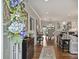 Bright foyer featuring hardwood floors, fresh white paint, and an open transition into the dining and kitchen area at 2829 Holt St, Charlotte, NC 28205