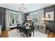 Elegant home office with wainscoting, custom lighting, and large windows at 2829 Holt St, Charlotte, NC 28205