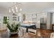 Bright, modern kitchen featuring a center island, stainless steel appliances, and hardwood floors at 2829 Holt St, Charlotte, NC 28205