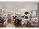 Spacious living room featuring hardwood floors, fresh white paint, fireplace, and an open layout at 2829 Holt St, Charlotte, NC 28205