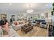 Spacious living room featuring hardwood floors and views to the kitchen, staircase, and dining room at 2829 Holt St, Charlotte, NC 28205