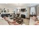 Bright open-concept living room featuring a fireplace, hardwood floors, recessed lighting, and open kitchen view at 2829 Holt St, Charlotte, NC 28205