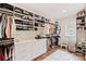 Organized walk-in closet with built-in shelving and ample storage space at 2829 Holt St, Charlotte, NC 28205