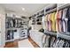 Spacious walk-in closet features custom shelving, hanging rods and ample storage space at 2829 Holt St, Charlotte, NC 28205