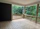 This wooden back porch has black siding and a view of the woods at 2915 Noritake Trl # 71, Albemarle, NC 28001