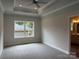 A bedroom boasts a trey ceiling with a fan and a window that lets in natural light at 2915 Noritake Trl # 71, Albemarle, NC 28001