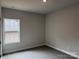 Serene bedroom featuring neutral paint, carpet, and a window at 2915 Noritake Trl # 71, Albemarle, NC 28001