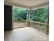 Spacious wooden deck overlooking a lush green forest, perfect for outdoor entertaining and relaxation at 2915 Noritake Trl # 71, Albemarle, NC 28001