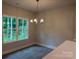 Bright dining area featuring hardwood floors, a chandelier, and a window with a view at 2915 Noritake Trl # 71, Albemarle, NC 28001