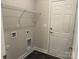 Practical laundry area featuring a door to the exterior, utility sink, and storage shelf at 2915 Noritake Trl # 71, Albemarle, NC 28001