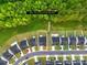 Aerial view of the neighborhood homes and lots with approximate lot lines in a wooded area at 3110 Streamside Dr, Davidson, NC 28036