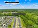 Aerial view of the neighborhood, community pool, and surrounding green spaces near Uptown Charlotte at 3110 Streamside Dr, Davidson, NC 28036