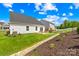 Beautiful backyard featuring well-maintained lawn and a cozy patio space at 3110 Streamside Dr, Davidson, NC 28036