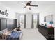 Comfortable bedroom features lots of natural light, closet, and ceiling fan at 3110 Streamside Dr, Davidson, NC 28036