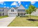 Charming two-story home boasts a well-maintained lawn, two-car garage, and classic curb appeal at 3110 Streamside Dr, Davidson, NC 28036