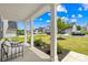 Inviting front porch offers seating and views of the landscaped front yard and neighborhood street at 3110 Streamside Dr, Davidson, NC 28036