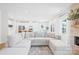 Bright and spacious open floor plan with white sofa, natural light, and access to kitchen at 3110 Streamside Dr, Davidson, NC 28036