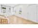 Bright living room with built-in shelving, hardwood floors, and natural light pouring in through the windows at 3110 Streamside Dr, Davidson, NC 28036