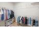 Spacious walk-in closet with ample hanging space, shelves, and storage solutions for organizing clothes and accessories at 3110 Streamside Dr, Davidson, NC 28036