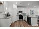 Bright kitchen featuring stainless steel appliances, granite countertops, and hardwood flooring at 3124 Butler Hill Dr, Matthews, NC 28105