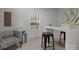Comfortable office area with modern décor, a bright window, patterned rug, and metallic side table at 3124 Butler Hill Dr, Matthews, NC 28105