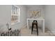 Well-lit office space with modern decor, a large window, stylish rug, and a comfortable chair at 3124 Butler Hill Dr, Matthews, NC 28105