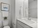 Cozy bathroom with contemporary white cabinets, toilet, and modern fixtures at 3128 Butler Hill Dr, Matthews, NC 28105