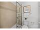 Bathroom featuring a sleek shower, toilet, and neutral tile at 3128 Butler Hill Dr, Matthews, NC 28105