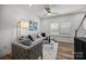 Comfortable living room featuring modern furnishings, wood flooring, and natural light at 3128 Butler Hill Dr, Matthews, NC 28105