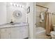 Bathroom with vanity with granite countertop, large decorative mirror, and bathtub with shower at 3128 Ethereal Ln, Charlotte, NC 28226