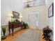 Light and airy foyer featuring hardwood floors, console table, and a soaring ceiling at 3128 Ethereal Ln, Charlotte, NC 28226