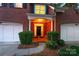 Home exterior featuring brick facade, front porch with columns, and a two-car garage at 3128 Ethereal Ln, Charlotte, NC 28226