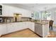 Bright kitchen with granite countertops, stainless steel appliances, and custom white cabinetry at 3128 Ethereal Ln, Charlotte, NC 28226