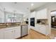 Eat-in kitchen showcasing granite counters, stainless appliances, and hardwood flooring at 3128 Ethereal Ln, Charlotte, NC 28226