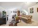 Spacious living room with cozy sofas, television, and a unique patterned rug, creating a welcoming atmosphere at 3128 Ethereal Ln, Charlotte, NC 28226