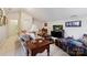 Cozy living room featuring comfortable seating, stylish decor, and a television with a streaming image at 3128 Ethereal Ln, Charlotte, NC 28226