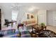 Bright living room with comfortable sofas, a desk, and a distinctive patterned rug, perfect for relaxing at 3128 Ethereal Ln, Charlotte, NC 28226