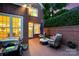 Relaxing outdoor patio features comfortable seating, brick accents, grill, and cozy ambiance at 3128 Ethereal Ln, Charlotte, NC 28226