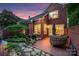 Inviting brick patio with comfortable seating, lush garden, and outdoor grilling area, perfect for entertaining at 3128 Ethereal Ln, Charlotte, NC 28226